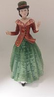 Front view of Royal Doulton Holly figure showing detailed clothing and pose.