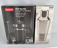 Boxed Bodum Java 4-piece French press coffee maker set and Sonesta cocktail shaker together.