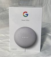 Front view of sealed Google Nest Mini 2nd generation box showing product image and brand logo.