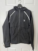 Front view of new black lightweight men's hooded jacket with reflective stripes and zipped pockets.