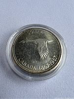 Obverse side showing Canada Goose in flight, marked with 'DOLLAR CANADA 1867-1967'.