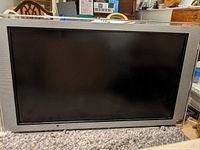 Front view of the 55 inch Sony Bravia LCD TV showing the screen and silver frame.