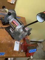 Craftsman 6-inch bench grinder with 3.5-inch Companion vise on wooden workbench, showing overall condition.