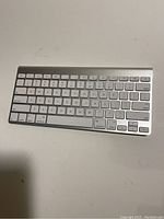 Top-down photo of the Apple wireless Bluetooth keyboard showing keys and layout.