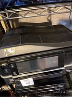 Photo showing Epson Artisan 810 printer front with control panel, flatbed scanner on top, and general condition