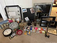 Overall view of vintage mirror, display shelves, clocks and various small decor and tools on carpet