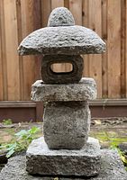 Front view of assembled five-piece lantern on bottom slab