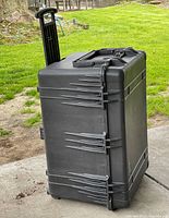 Side view of closed case with handle extended