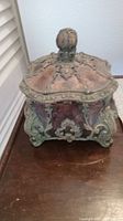 Square decorative box with removable lid showing external ornate detailing and antique finish