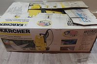 Original box of Karcher electric pressure washer showing product image and branding.