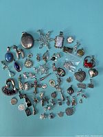 Overview of all sterling silver pendants on blue background