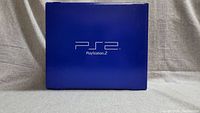 Front view of the blue Sony PlayStation 2 retail box with PS2 branding.