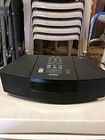 Front full view of Bose Wave Radio/CD showing speaker grille and top control buttons.