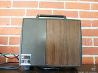 Front and top view of the vintage GAF 888-Z projector with power cord showing. The model label 888-Z is visible on the front panel.