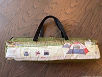 Green carry bag for Wenzel Sprout tent with handle and label identifying size and model.