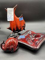Photo showing the red drip pottery angelfish, whale ashtray, and square dish together on a black background with size labels.