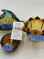 Photo showing all three glass items with size labels: Nuline Pisces ashtray 3 1/4", Viking amber dish 5 1/2" x 3 3/4", and Murano multicolor dish 5 1/2" wide.