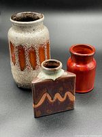Front and side view of all three pottery vases showing size and glaze colors.