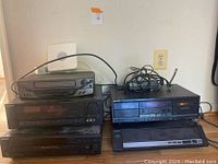 Sony entertainment system components including CD changer, stereo receiver, tape deck, turntable, and VCR