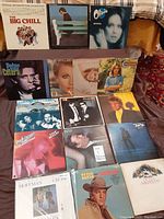 Photo showing 15 used vinyl records spanning various artists and soundtracks from 70s and 80s.