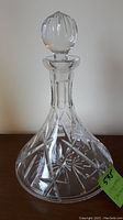 Full front view of the crystal ships decanter showing body and stopper