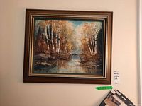 Frontal view of the framed painting on wall with display tag