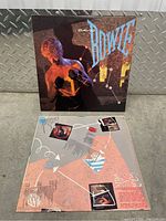 Front album cover and inner lyric sleeve laid out showing artwork and lyrics