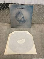 Front cover of the vinyl record showing abstract blue image and artist/title 'Phaedora'.
