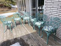 All six chairs arranged on a wood deck outdoors.