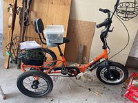 Side view of Liberty electric tricycle with rear basket, seat backrest and plastic storage box