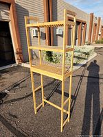 Full view of bamboo bathroom rack showing all three shelves and side frames