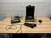 Colonel 500 megaphone with microphones and digital reference receiver on a wooden table