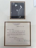 Close-up of matted frame showing upper photograph and letter below