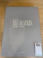 Front of silver slipcase with title embossing.