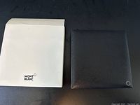 White Montblanc branded sleeve next to black leatherette outer presentation box