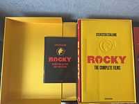 Opened slipcase showing book and smaller booklet inside