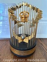 Front view of the trophy and Letter of Authenticity in background
