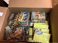 Top-down view of open box filled with hardback Nancy Drew books and other Carolyn Keene titles