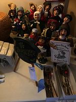 Overall view of multiple caroler figurines, chalkboard-style sign and lamp post accessories