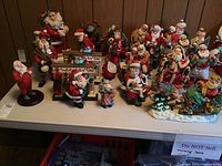 Overview of assorted Santa figurines on table