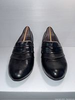 Front view of the pair of black leather Life Stride shoes showing toe shape and decorative bands
