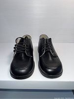Front view of the new black kids leather dress shoes size 1W.