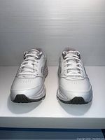 Front view of pair of white Saucony women's sneakers, size 7.5, laced and positioned side by side.