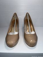 Front view of nude patent leather Steve Madden ladies high heel shoes, size 7.5.