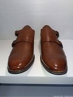 Front view of brown leather double monk strap men's shoes, size 10.5, showing toe cap detailing.