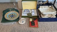 Lot overview showing Italian Bartoloni plate, boxed tea set, clear blown glass oil decanter, and teacups