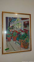 Full view of the framed painting depicting potted flowers on a balcony