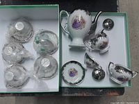 Full set overview with teapot, creamer, sugar bowl, and six cups and saucers wrapped for protection