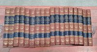 Full set of 20 hardcover volumes of pictorial encyclopedia arranged side by side