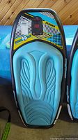 Top view of Hydroslide Magma kneeboard showing blue foam padding and colorful graphic with 'Magma' branding.